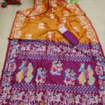 Orange color soft raw silk saree with woven design