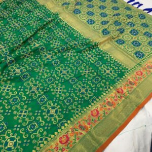 Green color patola silk saree with woven design