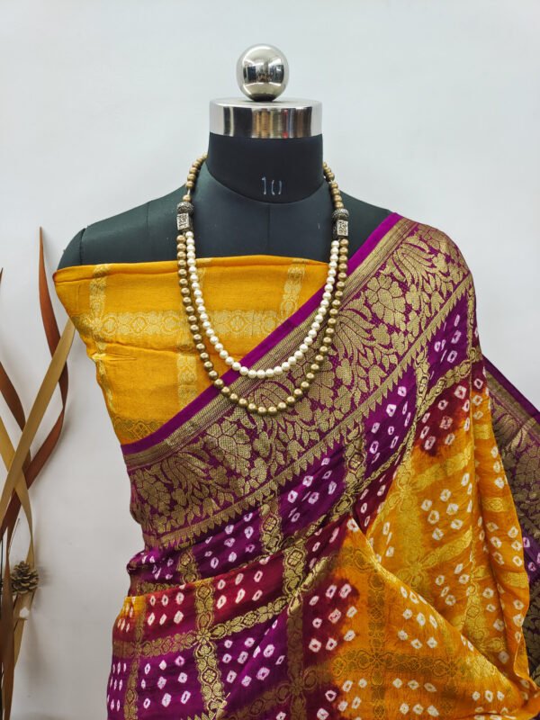 Yellow and magenta color hand bandhej silk saree with zari weaving work - Image 2