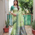 Pista green color dola silk saree with zari weaving work