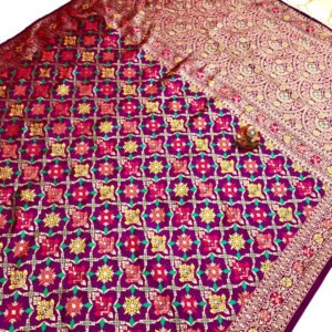 Magenta color patola silk saree with zari weaving work