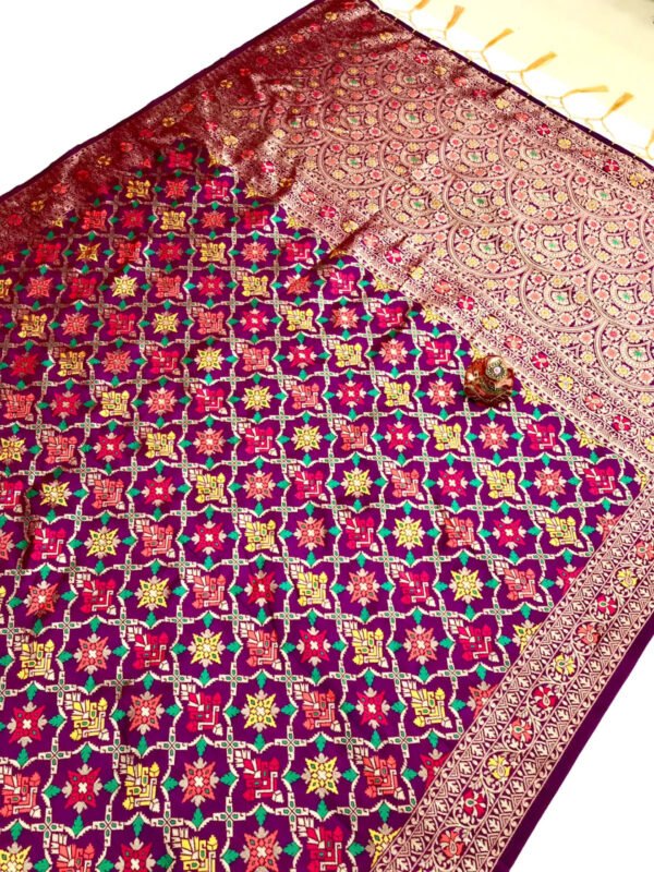 Magenta color patola silk saree with zari weaving work