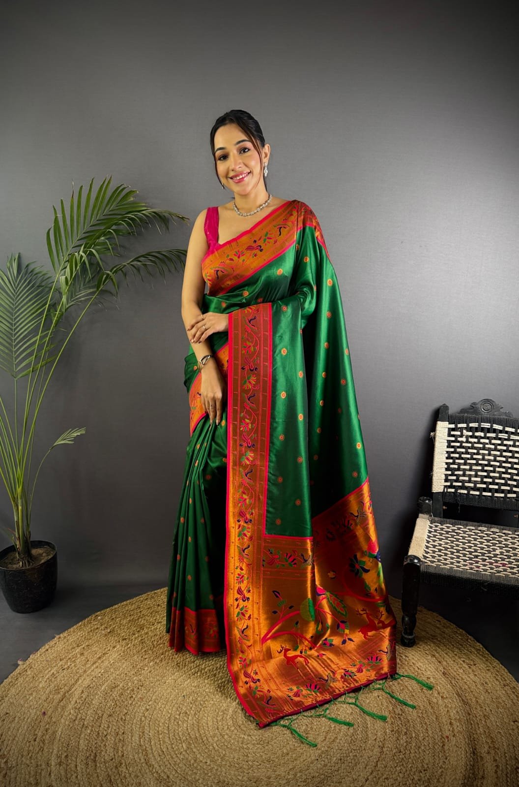 Dark green color paithani silk saree with zari weaving work